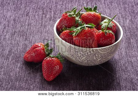 Ripe Strawberries In A Purple Bowl. Tasty And Fragrant.