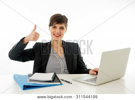 Portrait Of Happy Attractive Young Businesswoman On Laptop Looki