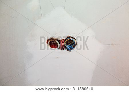 Unfinished Electrical  Mains Outlet Socket  With Electrical Wires Installed In Plasterboard Or Drywa