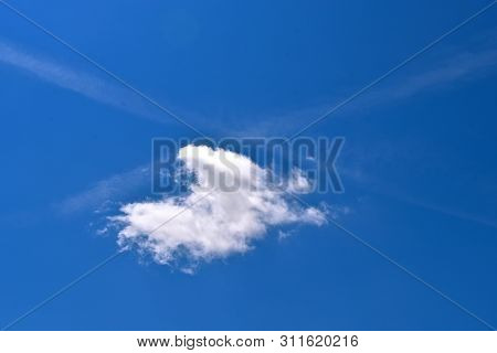 Condensation Tracks Or Vapor Trail Left By Two Airplanes Form An X Under The Point Of Intersection A