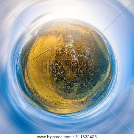 Helicopter Drone Shot. Aerial Photography Of A Green Field, Road, Small Village And Forest. Panorami