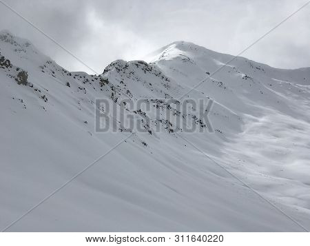 A Snowy Mountain Peak In The Canadian Rockies