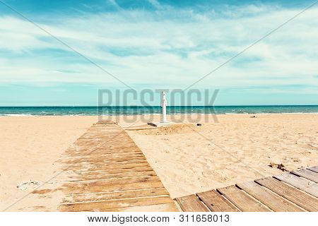 Wooden Path  To The Sea And Footbath Shower In Guardamar Del Segura, Alicante.spain