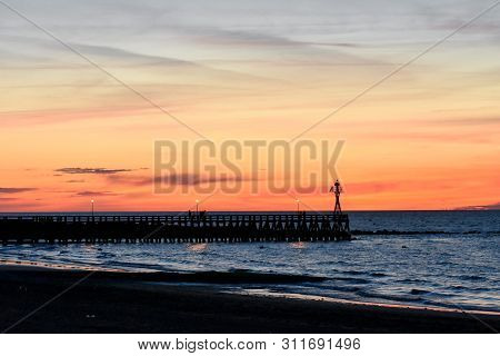 Romantic Colorful Sunset At Courseulles-sur-mer Pontoon. French Normandy