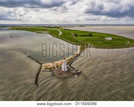 Aerial View Of The Lighthouse In Marken, A Small Island In The Middle Of The Markermeer In The Nethe