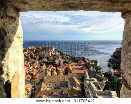 A View Through The Stone Window Of The Minceta Tower Or Fortress Looking Out At The Old Town And Wal