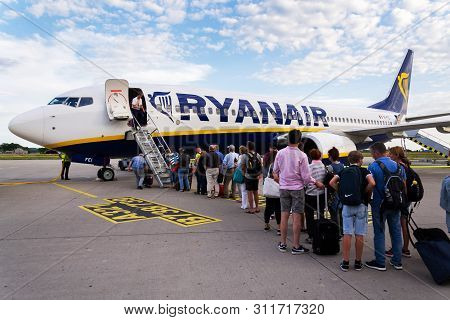 Memmingen, Germany - July 6 2019: People Boarding Ryanair Irish Low-cost Airline Plane Boeing 737 Wi