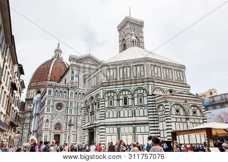 Florence, Italy - April, 2018: Tourists Visiting The Historical Baptistery Of St. John, Giotto Campa