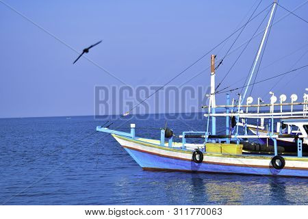 Traditional Sailing Wooden Boat On The Water Parking At The Harbour In Summer Holiday In Lampung, In