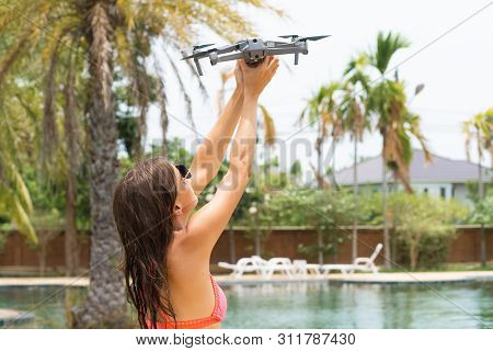 A Woman Launches A Drone For Flight, With Which You Can Take Photos And Video Filming