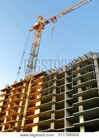 Construction Site Background. Hoisting Cranes And New Multi-storey Buildings. I.ndustrial Background