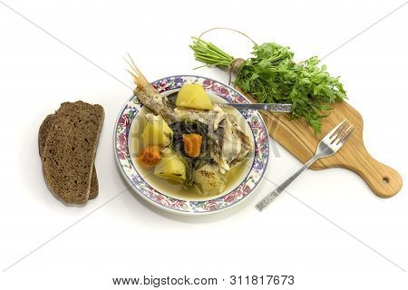 Ready Meals. Fish Soup In A Plate From Grouper (epinephelus Aeneus) On A White Background Close-up