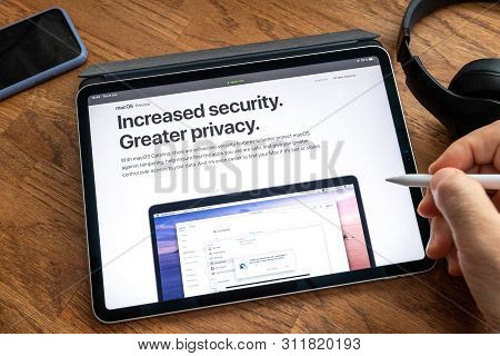 Paris, France - Jun 6, 2019: Man Reading On Apple Ipad Pro Tablet About Latest Announcement Of At Ap