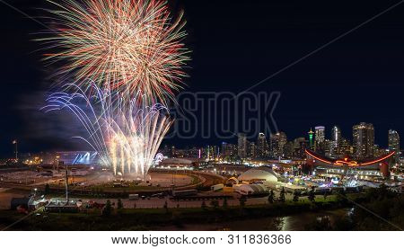 Calgary, Canada - July 14, 2019: Colorful Firework Display Over The Night Sky With The Calgary Downt