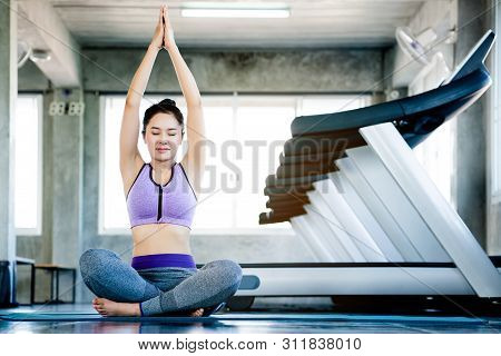 Portrait Of Beautiful Asian Women Playing Bikram Yoga In The Gym To Change Yourself To Healthy Body 
