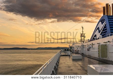 Delta, Canada - July 12, 2019: Bcferries Boat In Open Water Near Tsawwassen Ferry Terminal Sunset Ri
