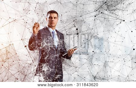 Business Person Pointing On Abstract Network Structure. Standing Personal Assistant In Business Suit