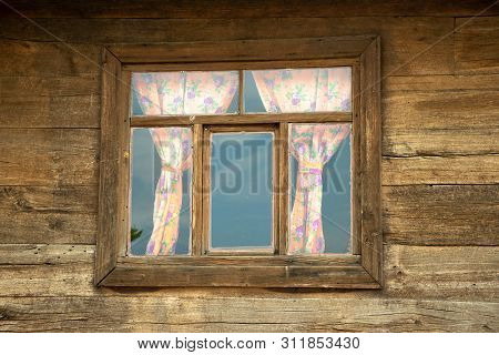 Old Wooden House Window. Old Curtain Photo