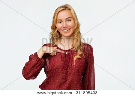 Happy Woman Pointing Fingers At Herself. Select Me Please Concept