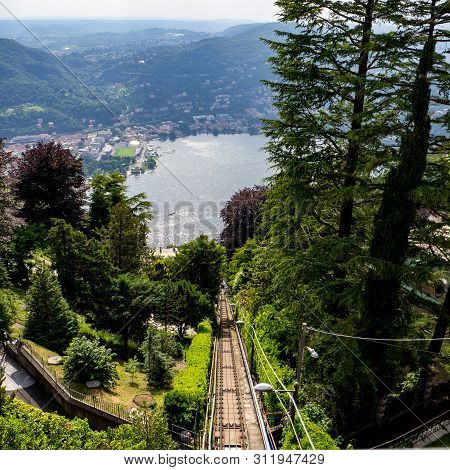 View Of Lake Como In Cloudy Day With The Buildings Of Bellagio, A Charming Tourist Village