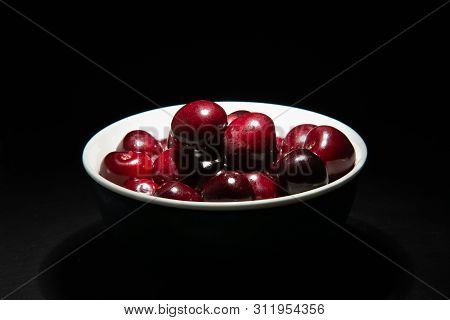 Delicious Bigarreau Cherry In A Black Background