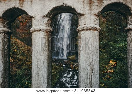 A View Of Multnomah Falls Through Benson Bridge In The Fall, In The Columbia River Gorge, Oregon, Us