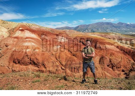 Man in Valley of Mars landscapes in the Altai Mountains, Russia