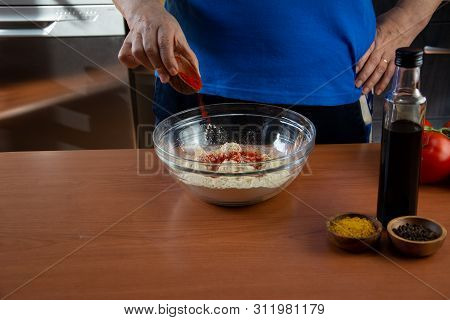 Mature Woman Doing The Seitan Cooking Process At Home. How To Prepare Seitan At Home Vegan Meat