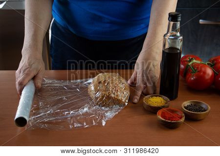 Mature Woman Doing The Seitan Cooking Process At Home. How To Prepare Seitan At Home Vegan Meat
