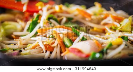 Process Of Cooking Of Sweet And Crunchy Stir Fry With Beansprouts In The Wok, Macro Image