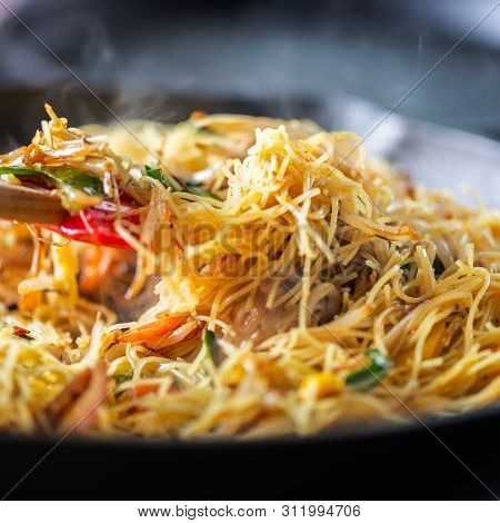 Process Of Cooking Of Sweet And Crunchy Stir Fry With Beansprouts And Noodles In The Wok, Macro Imag