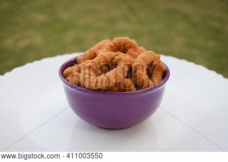 Side View Of South Indian Traditional Snack Item, Evening Tea Time Item Chegodilu Or Ring Murukku Is