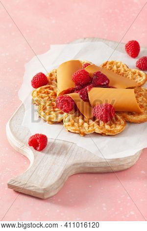 waffles with Norwegian brunost traditional brown cheese and raspberry jam