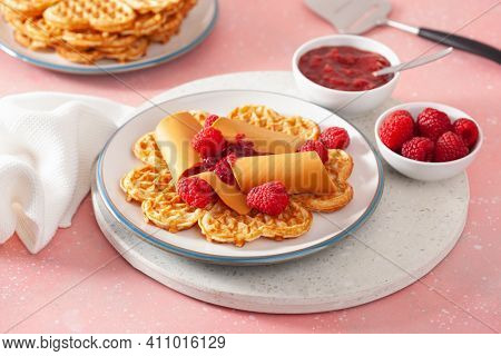 waffles with Norwegian brunost traditional brown cheese and raspberry jam