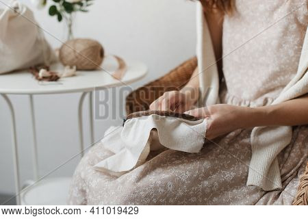 The Woman Holds A Hoop And Embroidery.