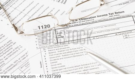 Tax Form With Glasses And Pen. Tax Concept