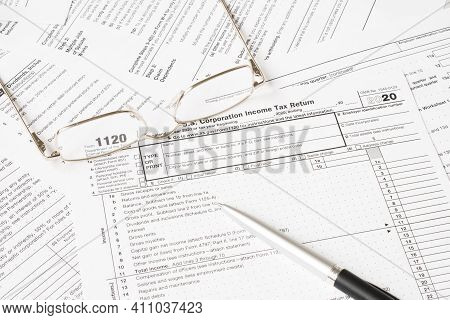 Tax Form With Glasses And Pen. Tax Concept