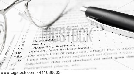 Federal Income Tax Laws W9 Form. Pen And Spectacles
