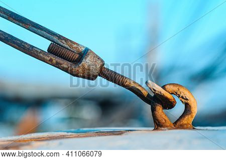 Stainless Steel Turnbuckle Hook And Steel Wire Cable Rope Connection Ties And Connections Concept. B