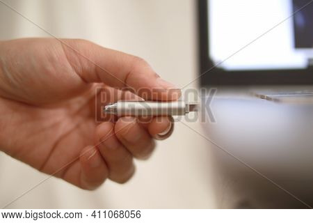 Person Inserting Plug In Flashdisk Into Usb Port In Laptop Personal Computer, Data Transfer Device C