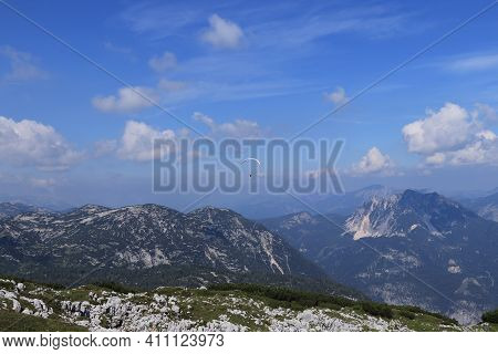 Experienced Parachutist Flies In The Right Wind And Drives A Parachute Around The Austrian Alps. Par