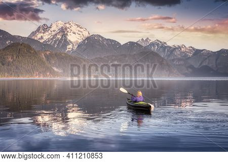 Adventurous Girl Kayaking On An Infatable Kayak In A Beautiful Lake. Colorful Peaceful Sunrise Art R