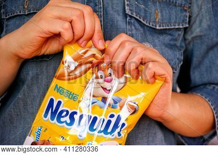 Tambov, Russian Federation - January 30, 2021 Woman Hands Ready To Open Nesquik Candies Pack