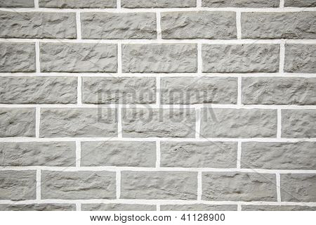 Muro di mattoni grigi