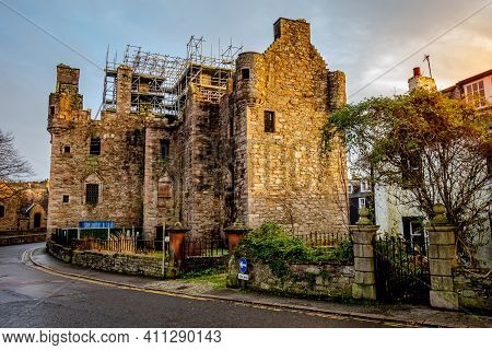 Maclellan's Castle Under Repair On The Old High Street In Kirkcudbright At Sunset, Dumfries And Gall