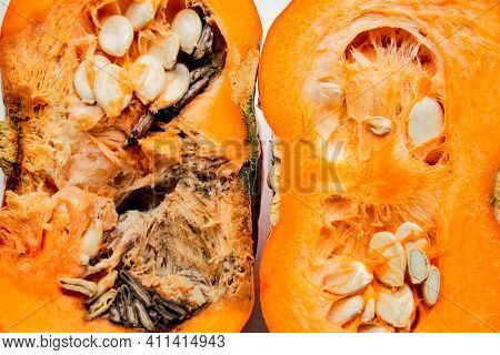 A Pumpkin Cut In Half, Left Half Is Rotten, Right Half - Good Quality, On A White Background.
