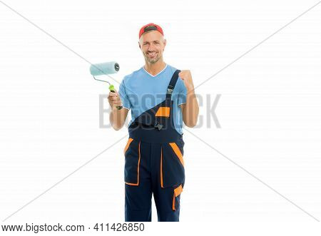 Decorator Creative Work. Paint And Renovate. Decorator Painting Wall. Man In Cap Hold Paint Roller W