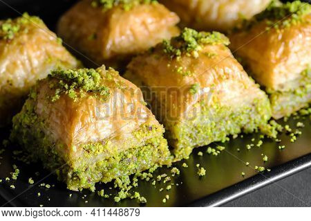 Traditional Turkish Dessert Antep Baklava With Pistachio On Rustic Table, Ramadan Or Holiday Dessert