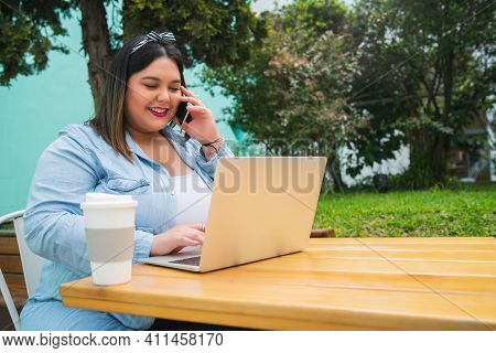 Portrait Of Young Pluse Size Woman Using