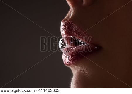 Closeup Female Open Mouth With Film Of Saliva. Saliva Drips From Erotic Mouth